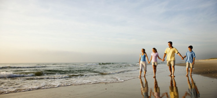 Family walking on the beach